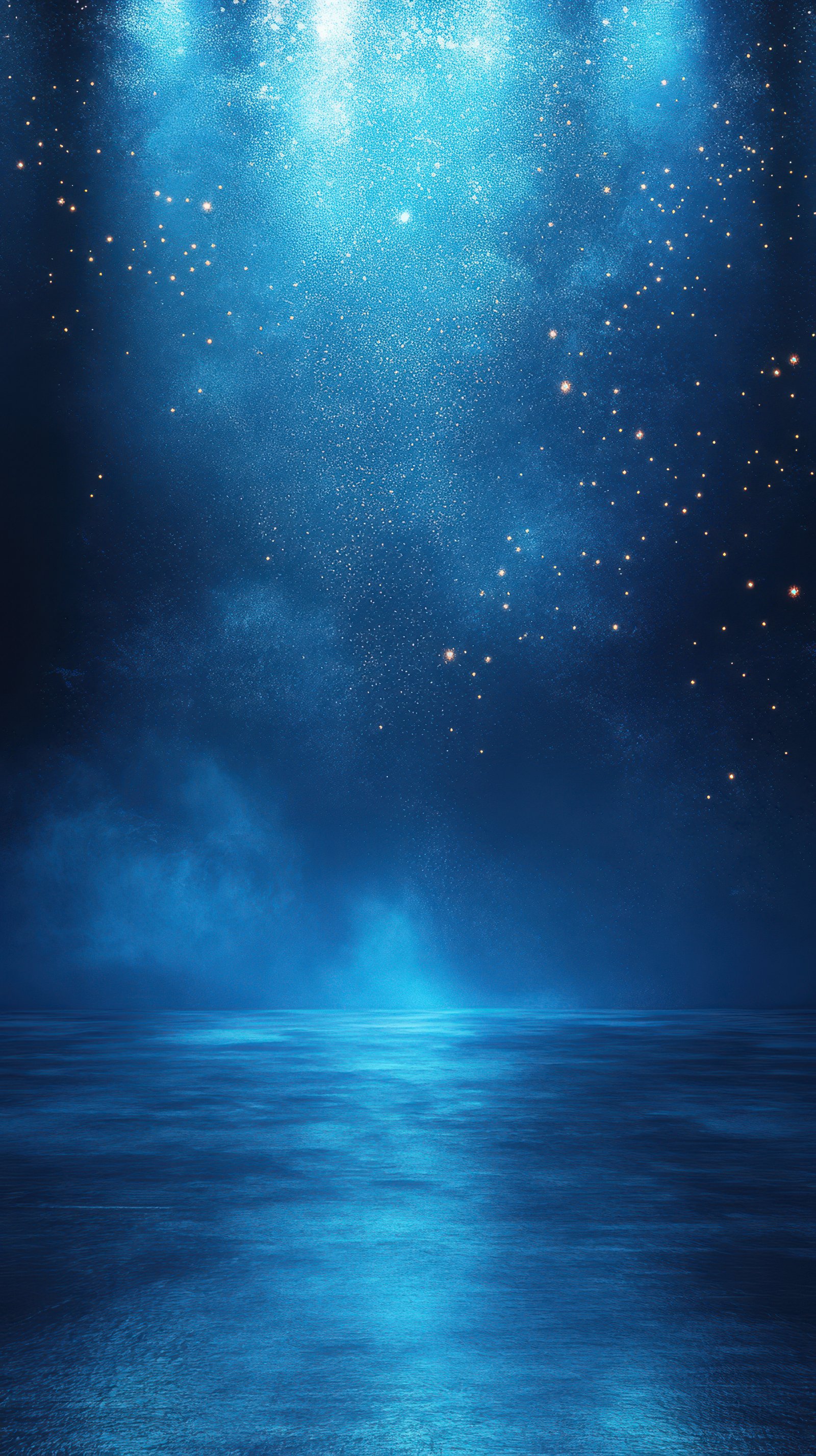 Night sky filled with shimmering stars over calm ocean waters illuminated by blue light